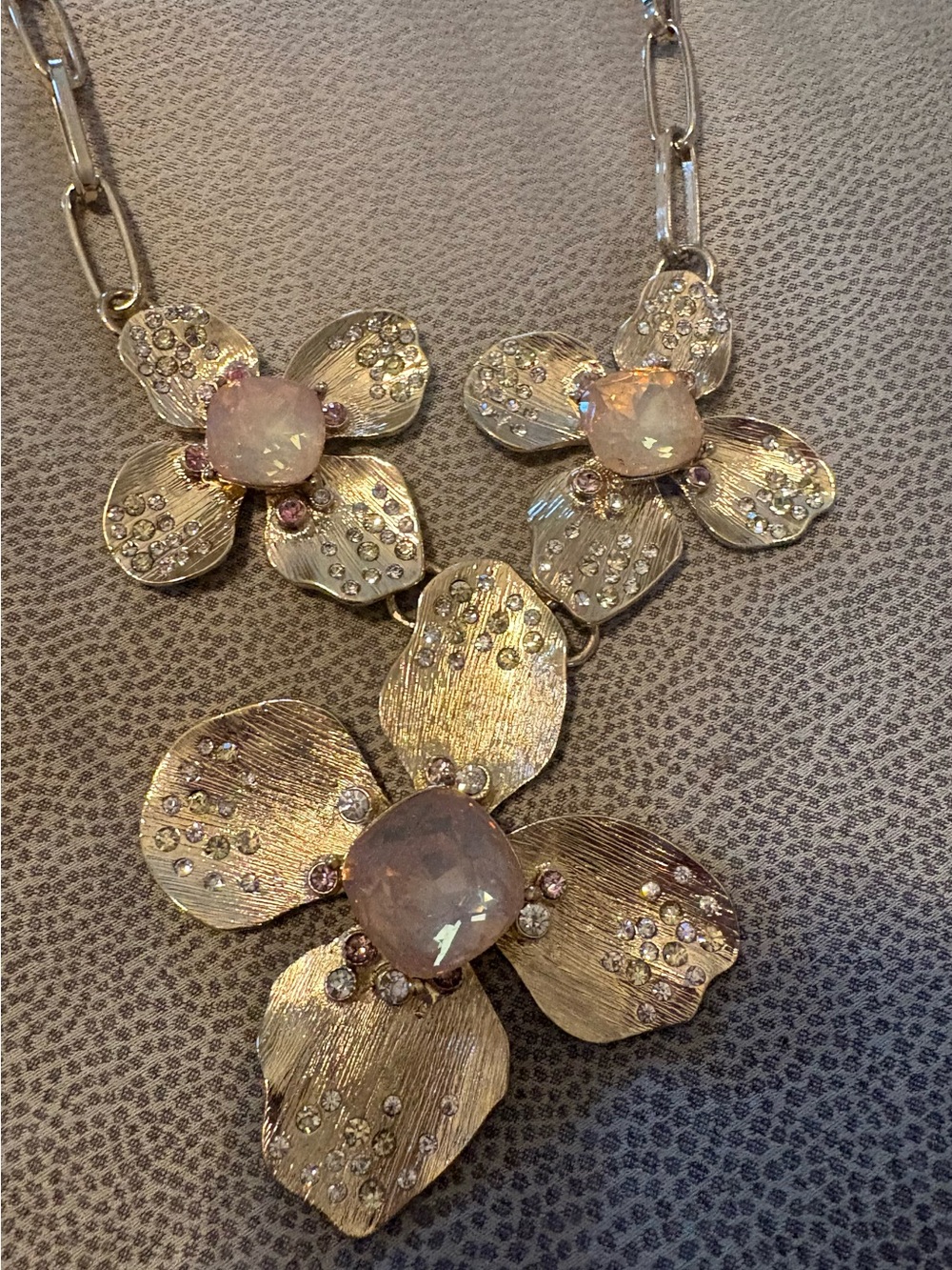 Graziano Gold floral statement necklace w milky rhinestone.